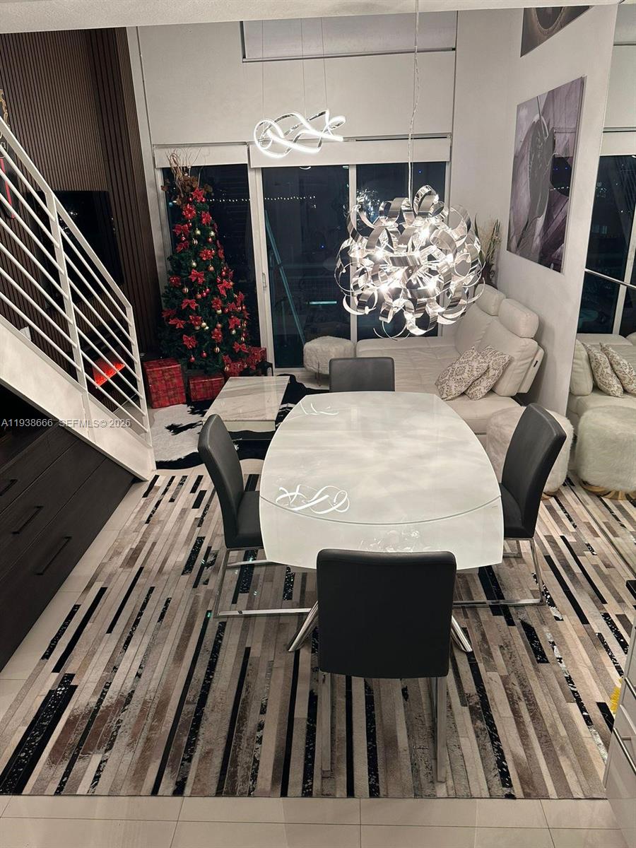 60 Southwest 13th Street, Unit 2422 Miami, FL 33130 - Photo 22 of 33 a view of table and chair in kitchen