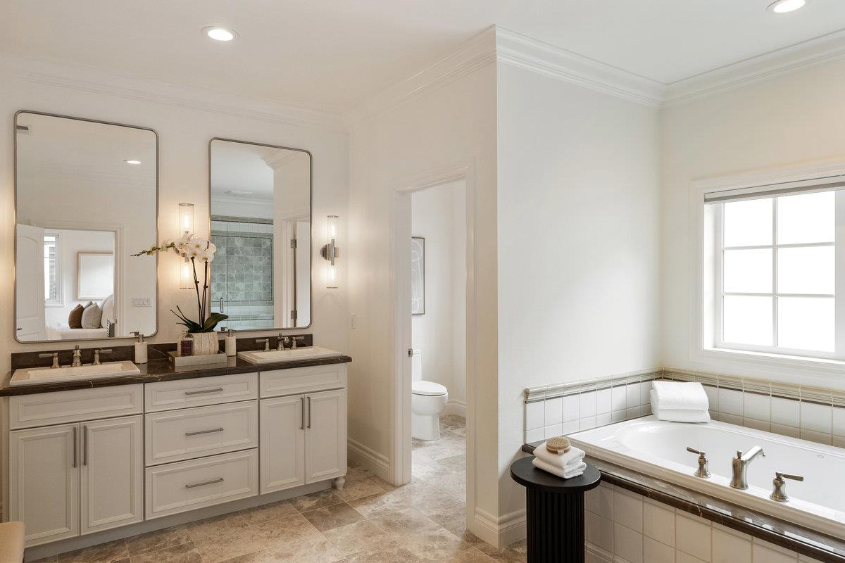 116 Carnoustie Drive Half Moon Bay, CA 94019 - Photo 12 of 27 a bathroom with a granite countertop sink mirror and a toilet