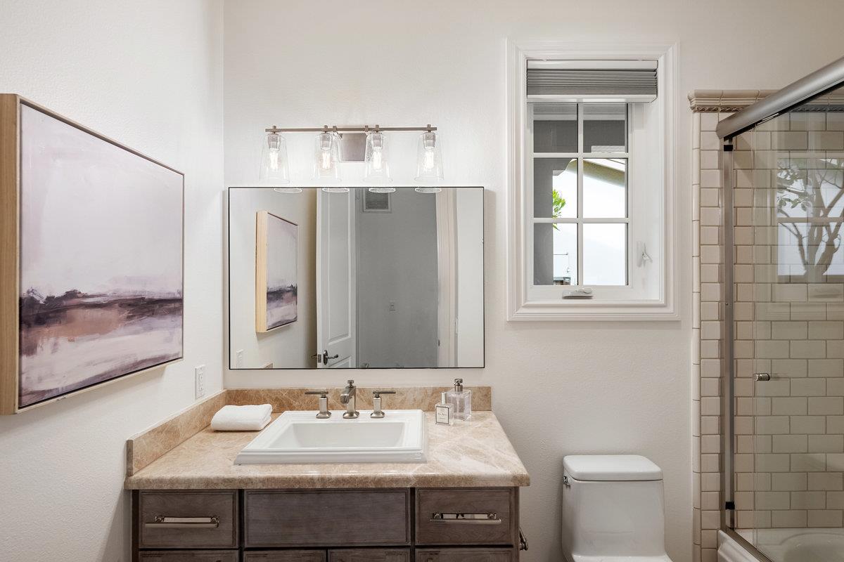 116 Carnoustie Drive Half Moon Bay, CA 94019 - Photo 18 of 27 a bathroom with a sink and a mirror