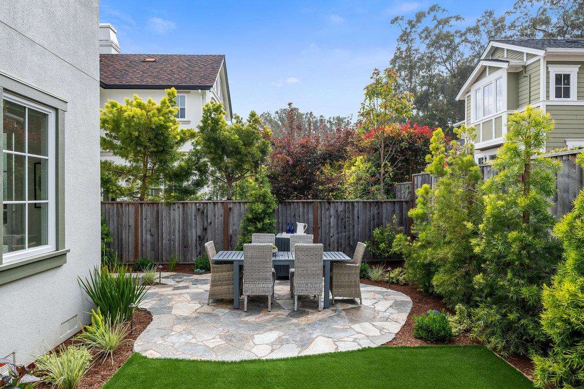 116 Carnoustie Drive Half Moon Bay, CA 94019 - Photo 20 of 27 a view of a chair and table in backyard of the house