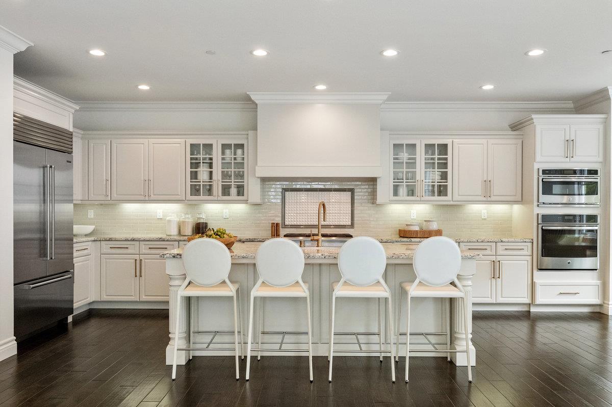 116 Carnoustie Drive Half Moon Bay, CA 94019 - Photo 7 of 27 a large kitchen with a table and chairs