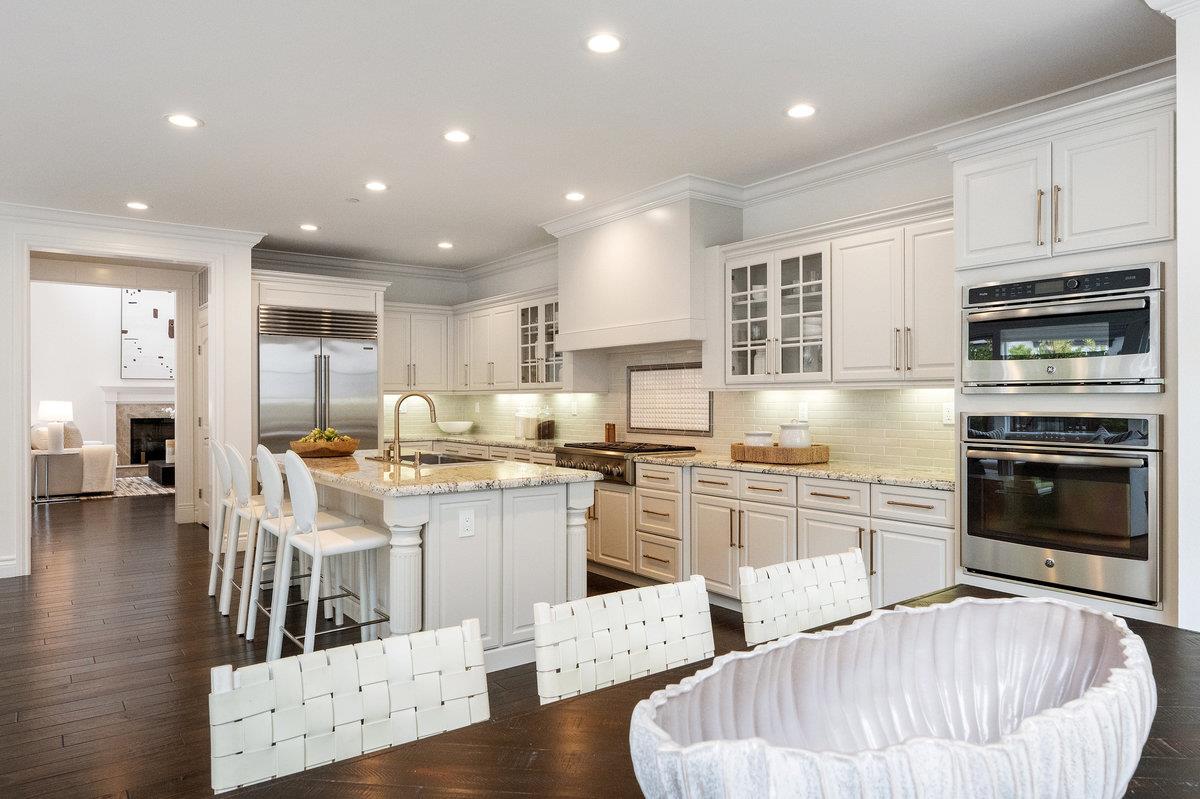 116 Carnoustie Drive Half Moon Bay, CA 94019 - Photo 9 of 27 a kitchen with stainless steel appliances granite countertop a stove refrigerator and cabinets