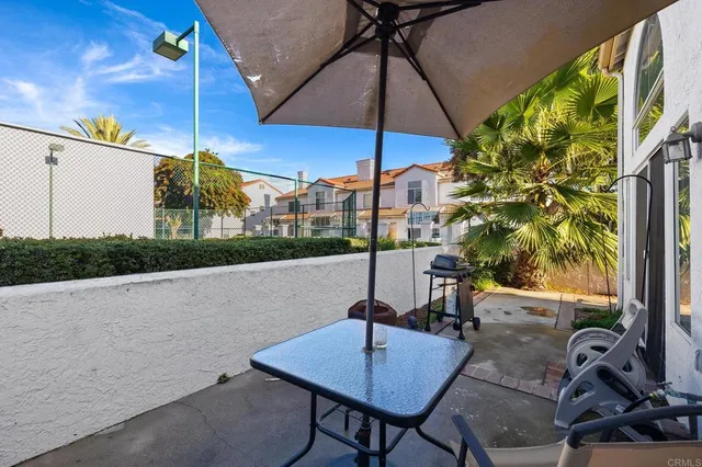 a view of a chairs and table in the patio