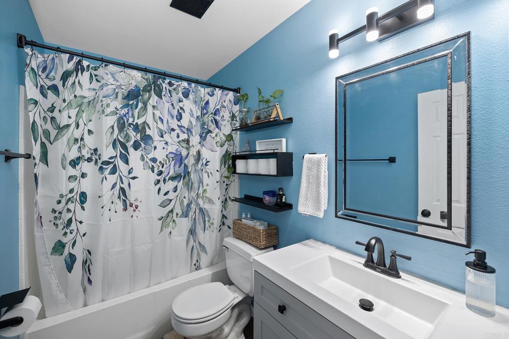 29495 Cara Way Temecula, CA 92591 - Photo 25 of 40 a bathroom with a sink toilet and shower