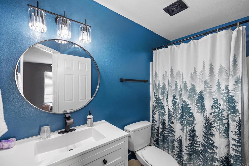29495 Cara Way Temecula, CA 92591 - Photo 27 of 40 a bathroom with a sink mirror and toilet