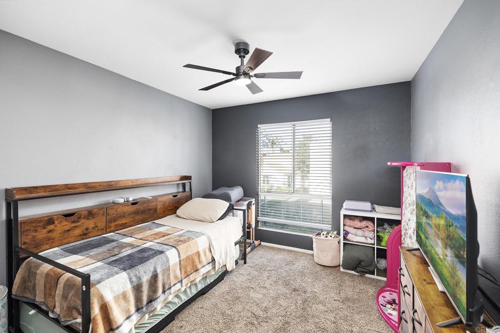 29495 Cara Way Temecula, CA 92591 - Photo 28 of 40 a bedroom with a bed and a window