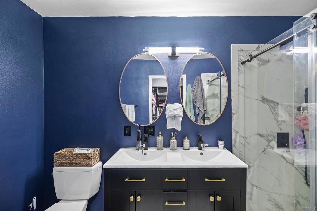 29495 Cara Way Temecula, CA 92591 - Photo 32 of 40 a bathroom with a toilet sink and mirror