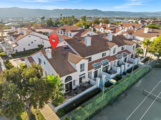 an aerial view of a house with a garden