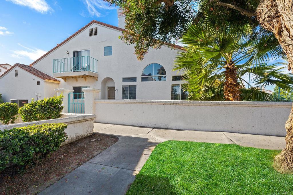 29495 Cara Way Temecula, CA 92591 - Photo 6 of 40 a front view of a house with a yard