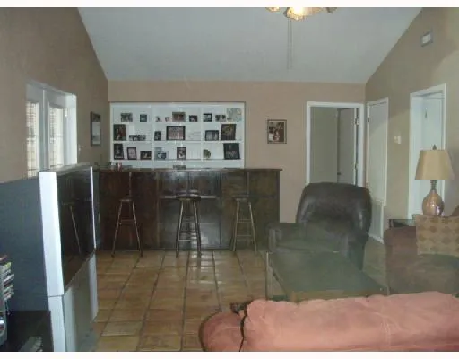 a kitchen with a refrigerator and cabinets