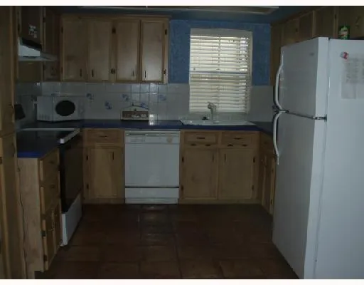 a dining room with furniture and a window