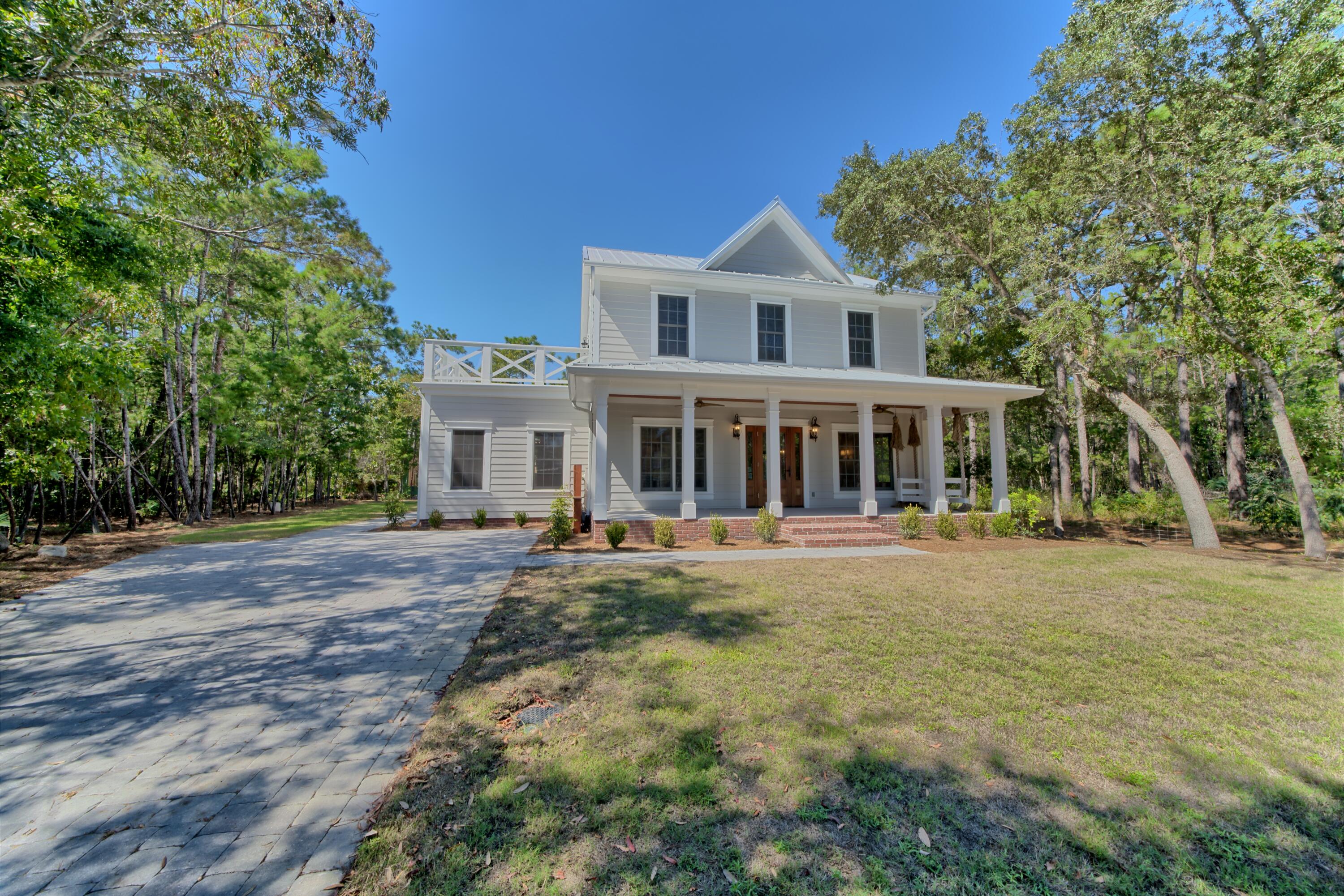 521 Clareon Drive Inlet Beach, FL 32461 - Photo 1 of 66 a front view of a house with a yard