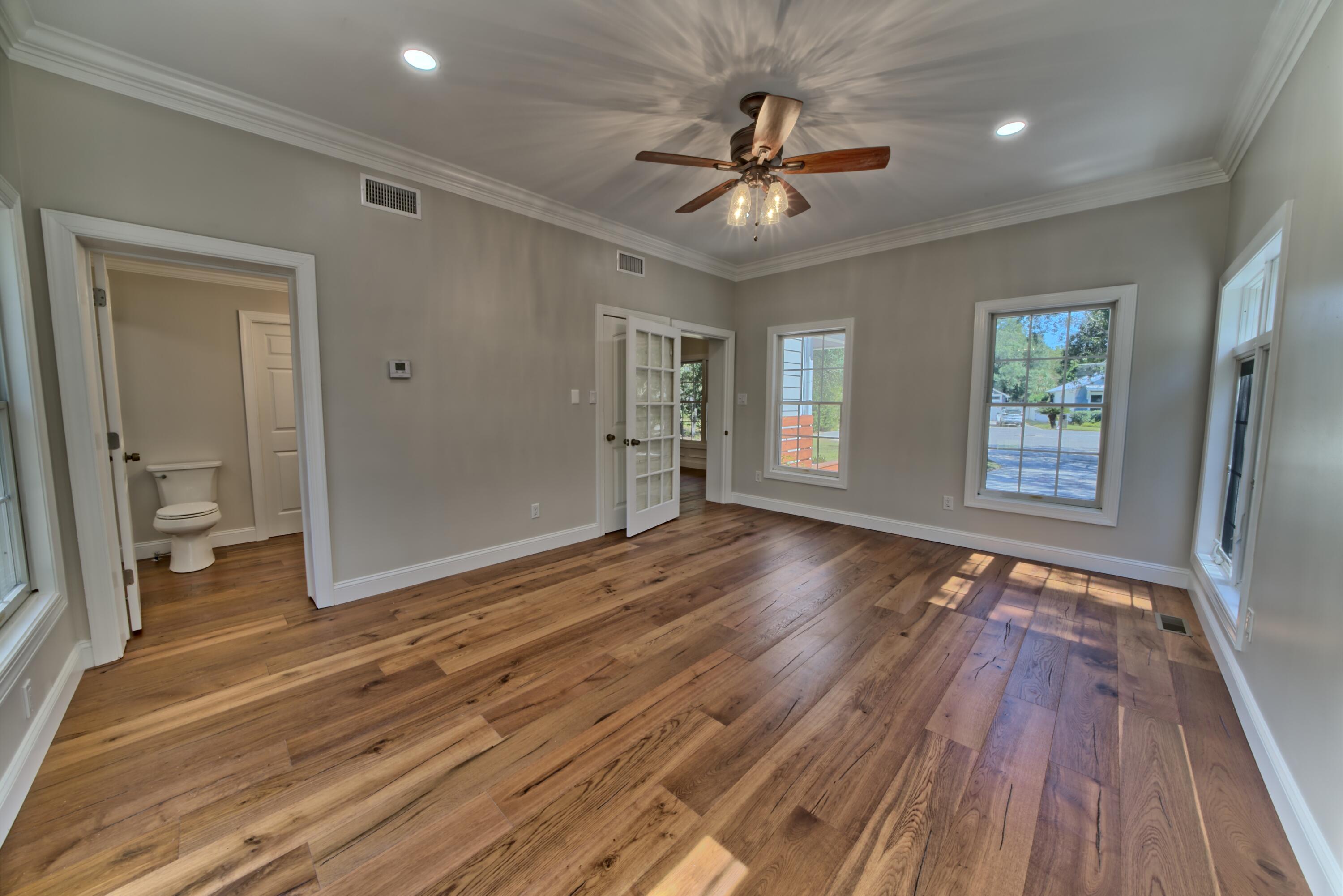 521 Clareon Drive Inlet Beach, FL 32461 - Photo 13 of 66 a view of an empty room with wooden floor and a window