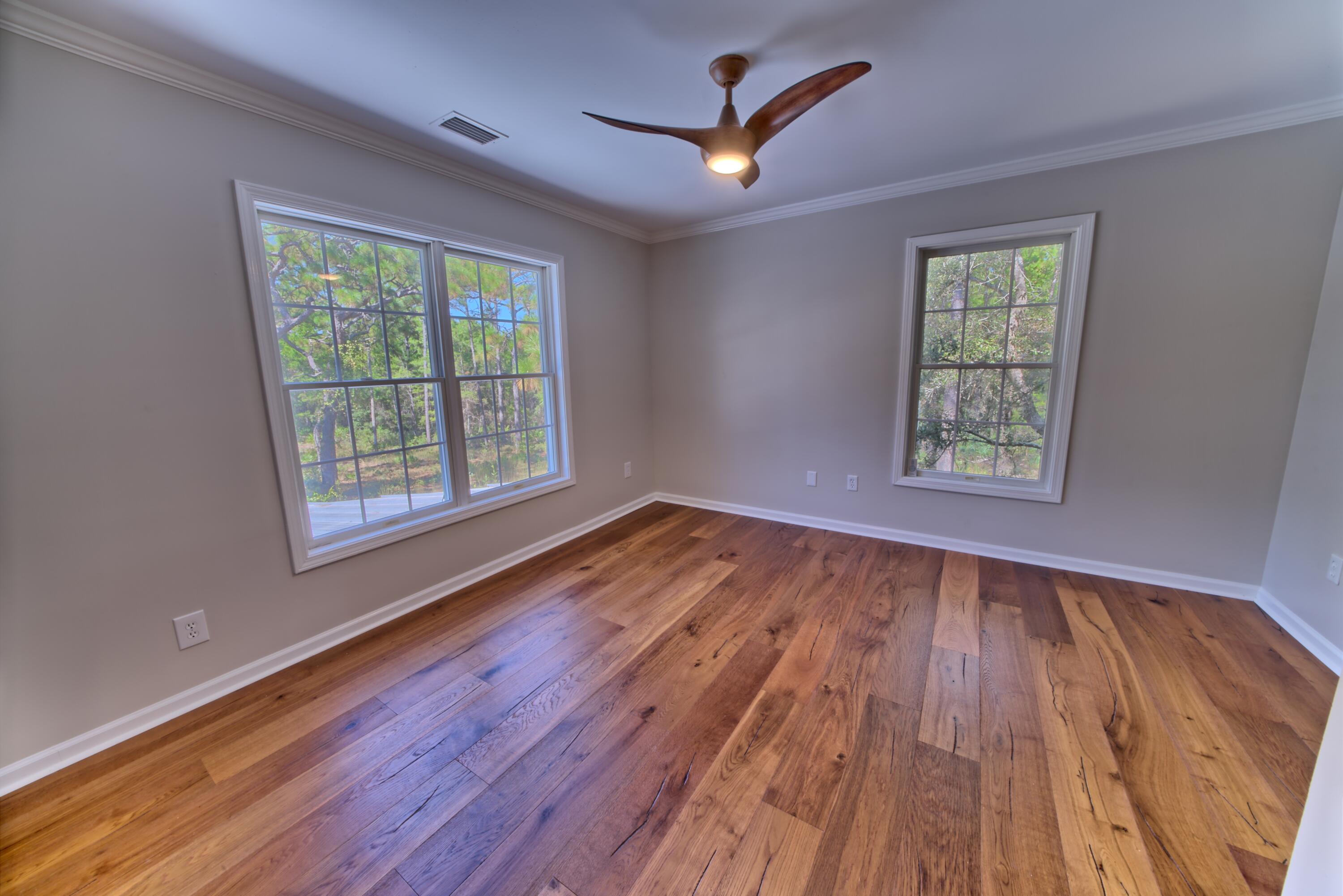 521 Clareon Drive Inlet Beach, FL 32461 - Photo 22 of 66 a view of an empty room with wooden floor and a window