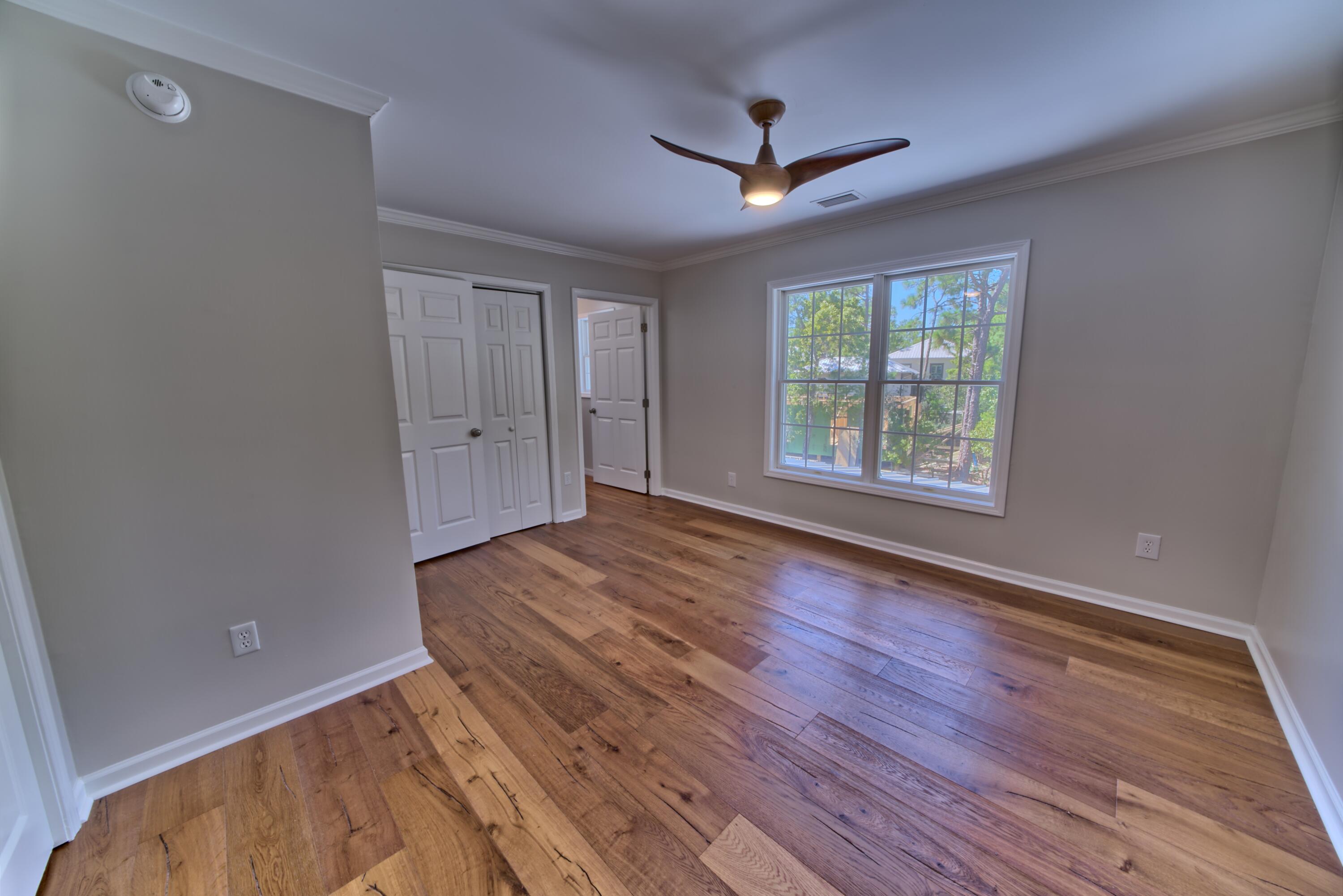 521 Clareon Drive Inlet Beach, FL 32461 - Photo 25 of 66 wooden floor in an empty room with a window