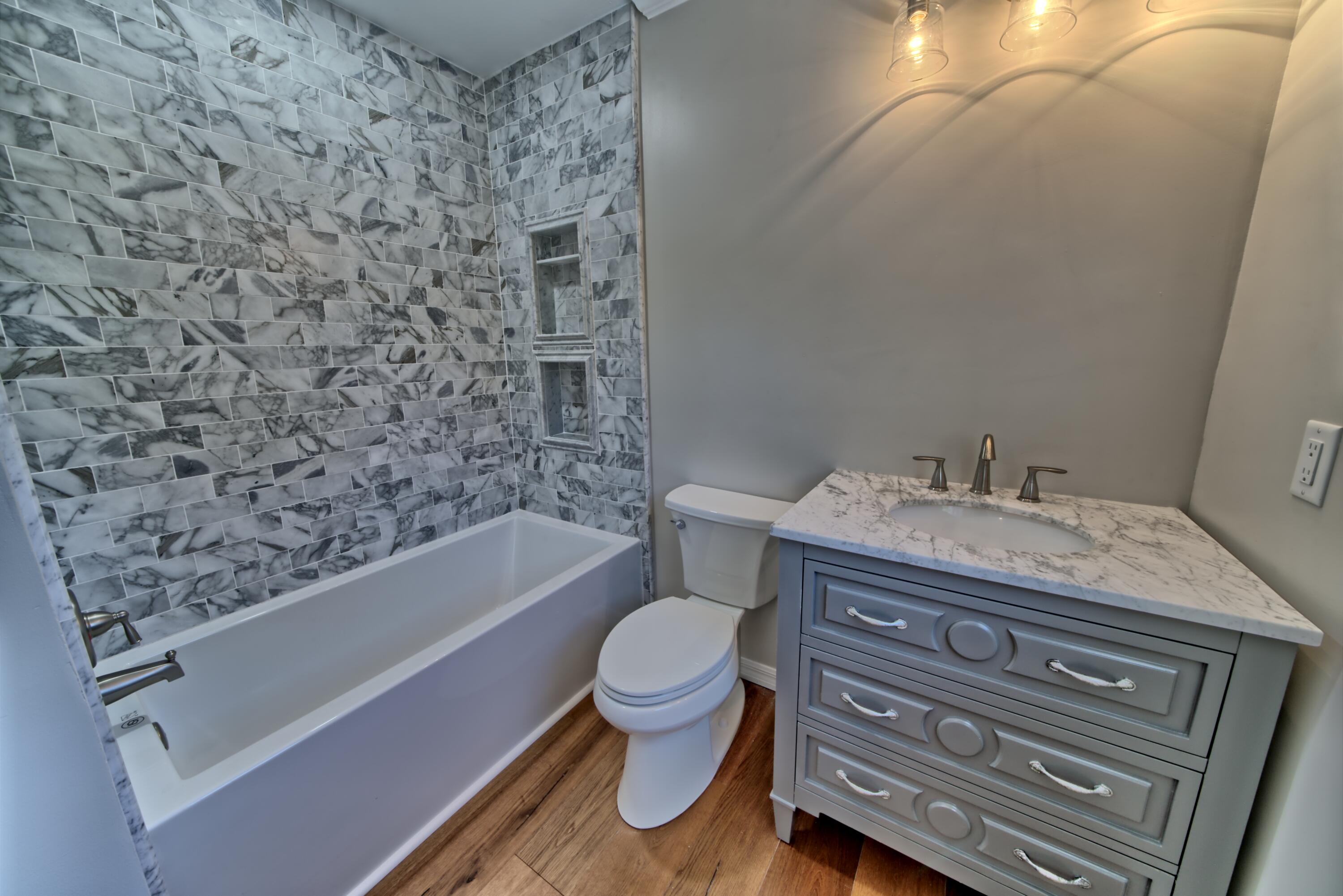 521 Clareon Drive Inlet Beach, FL 32461 - Photo 27 of 66 a bathroom with a granite countertop toilet and a sink