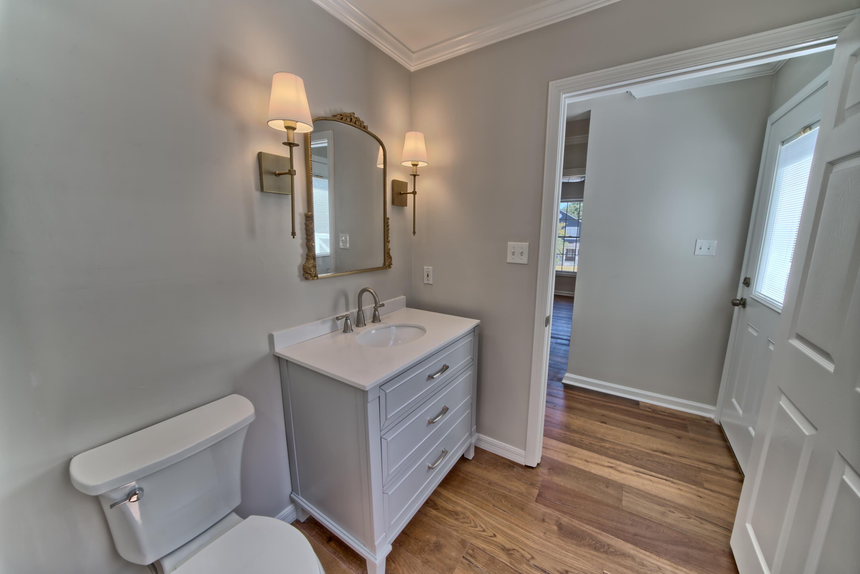 521 Clareon Drive Inlet Beach, FL 32461 - Photo 30 of 66 a spacious bathroom with a toilet sink and mirror