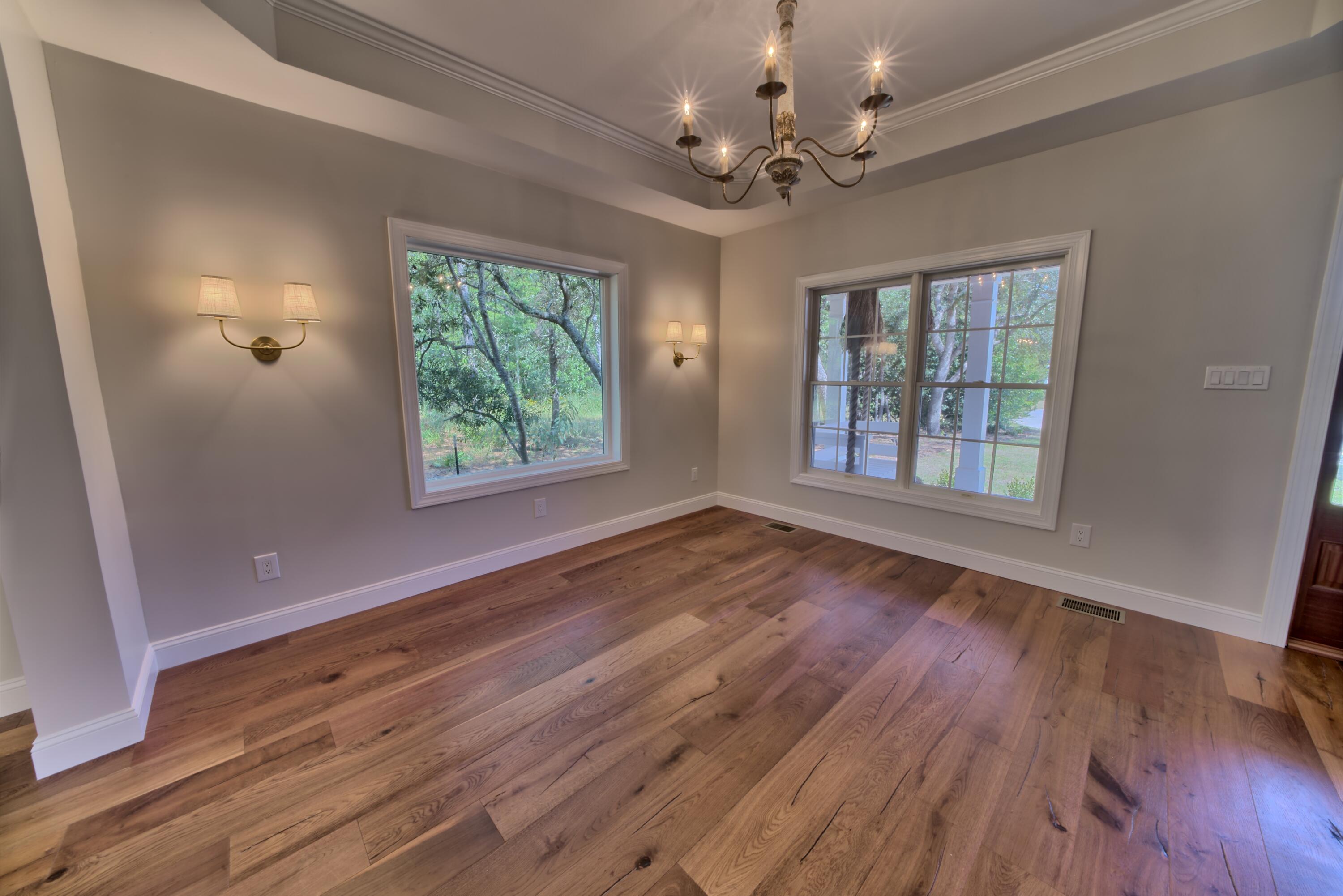 521 Clareon Drive Inlet Beach, FL 32461 - Photo 3 of 66 a view of an empty room with wooden floor and a window