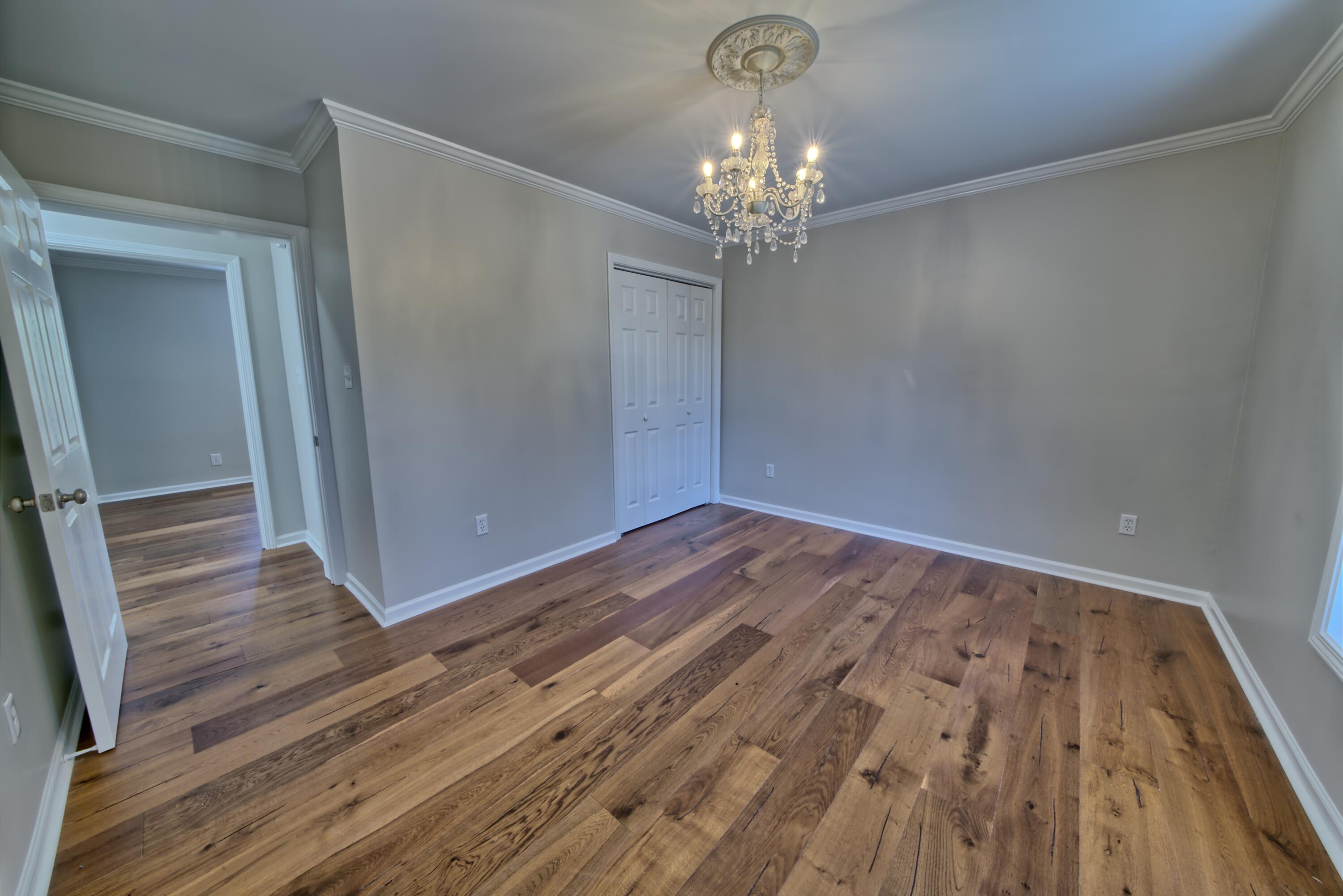 521 Clareon Drive Inlet Beach, FL 32461 - Photo 36 of 66 a view of a room with wooden floor and chandelier