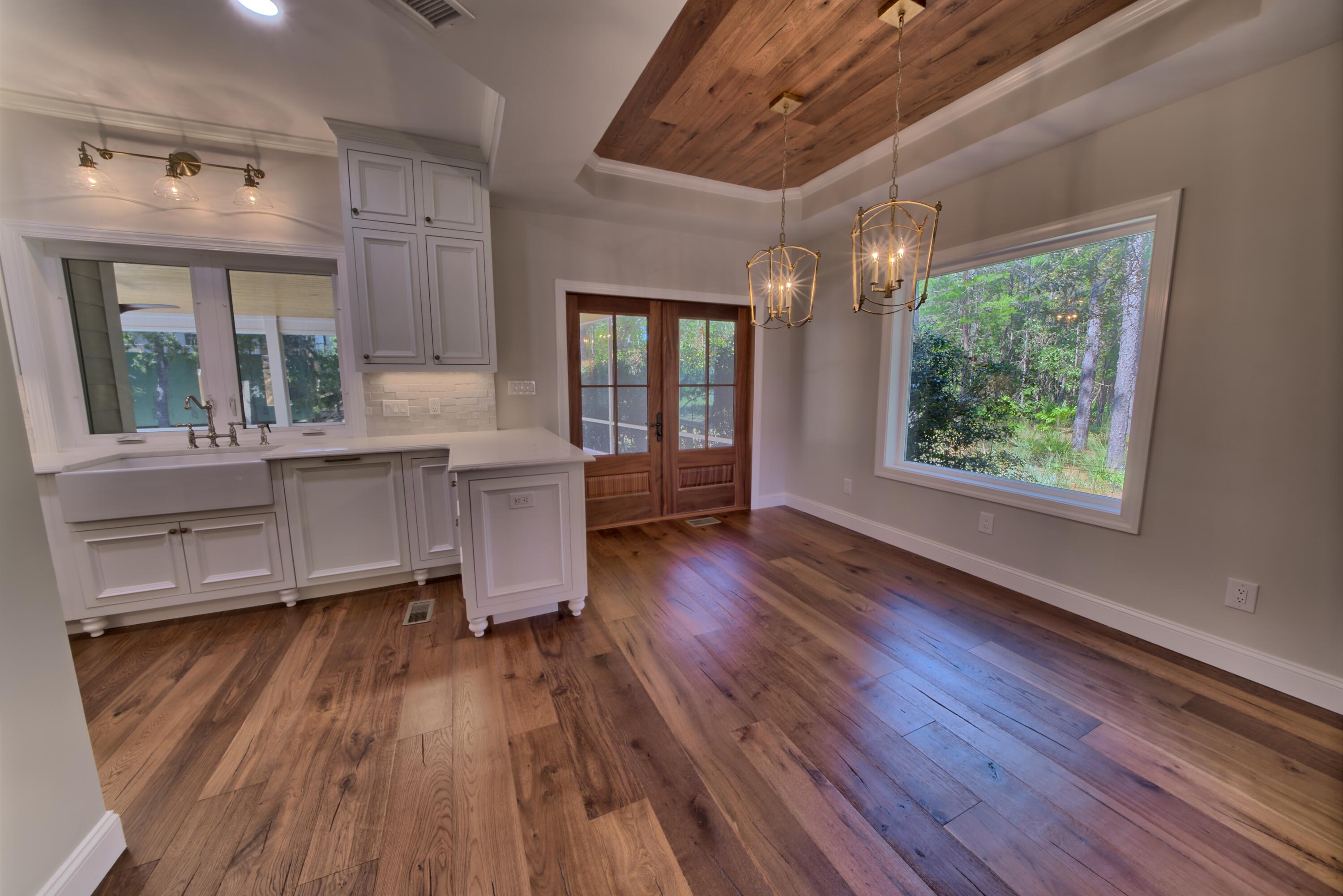 521 Clareon Drive Inlet Beach, FL 32461 - Photo 4 of 66 a room with wooden floors and windows