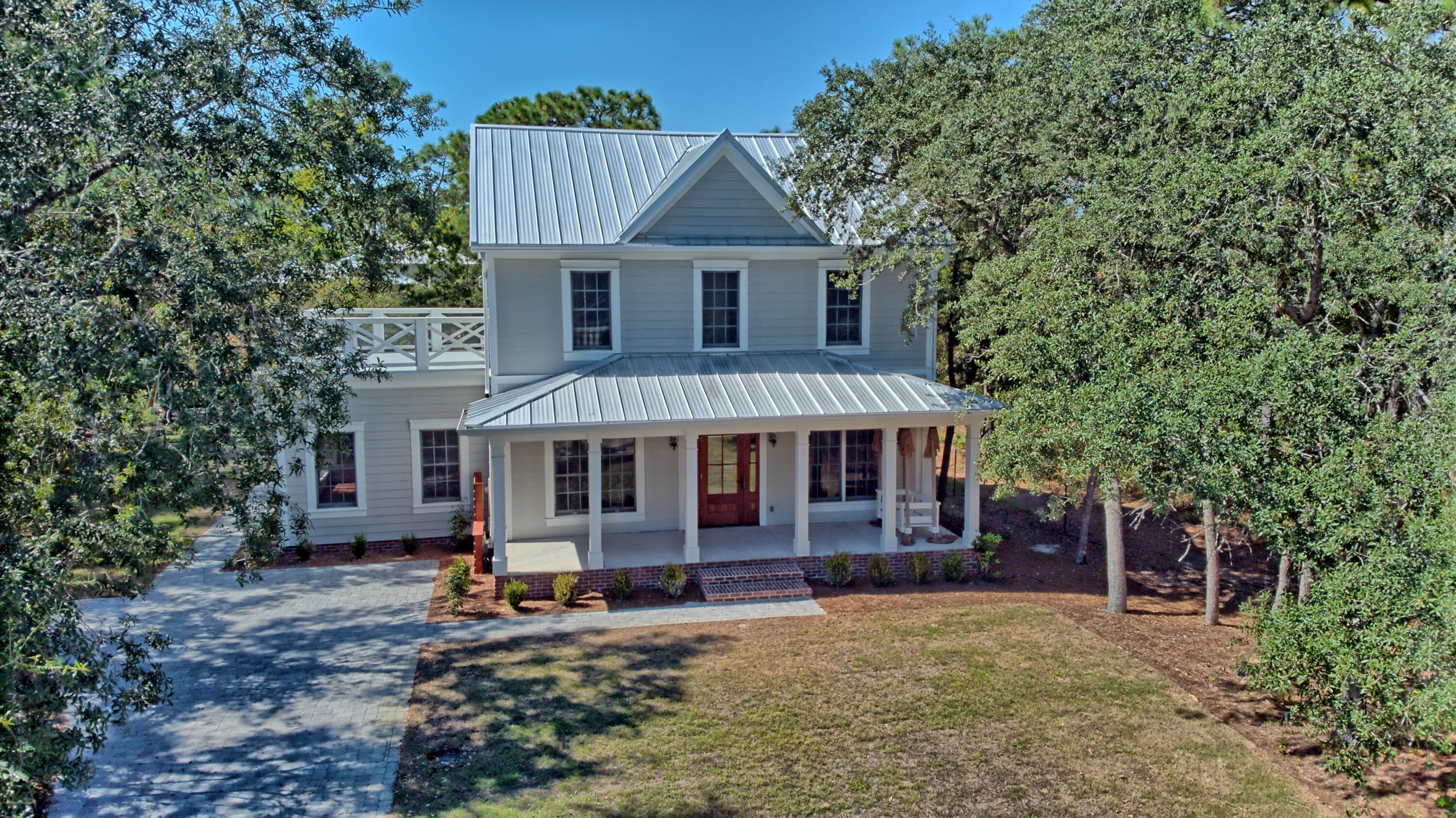 521 Clareon Drive Inlet Beach, FL 32461 - Photo 41 of 66 front view of a house with a yard