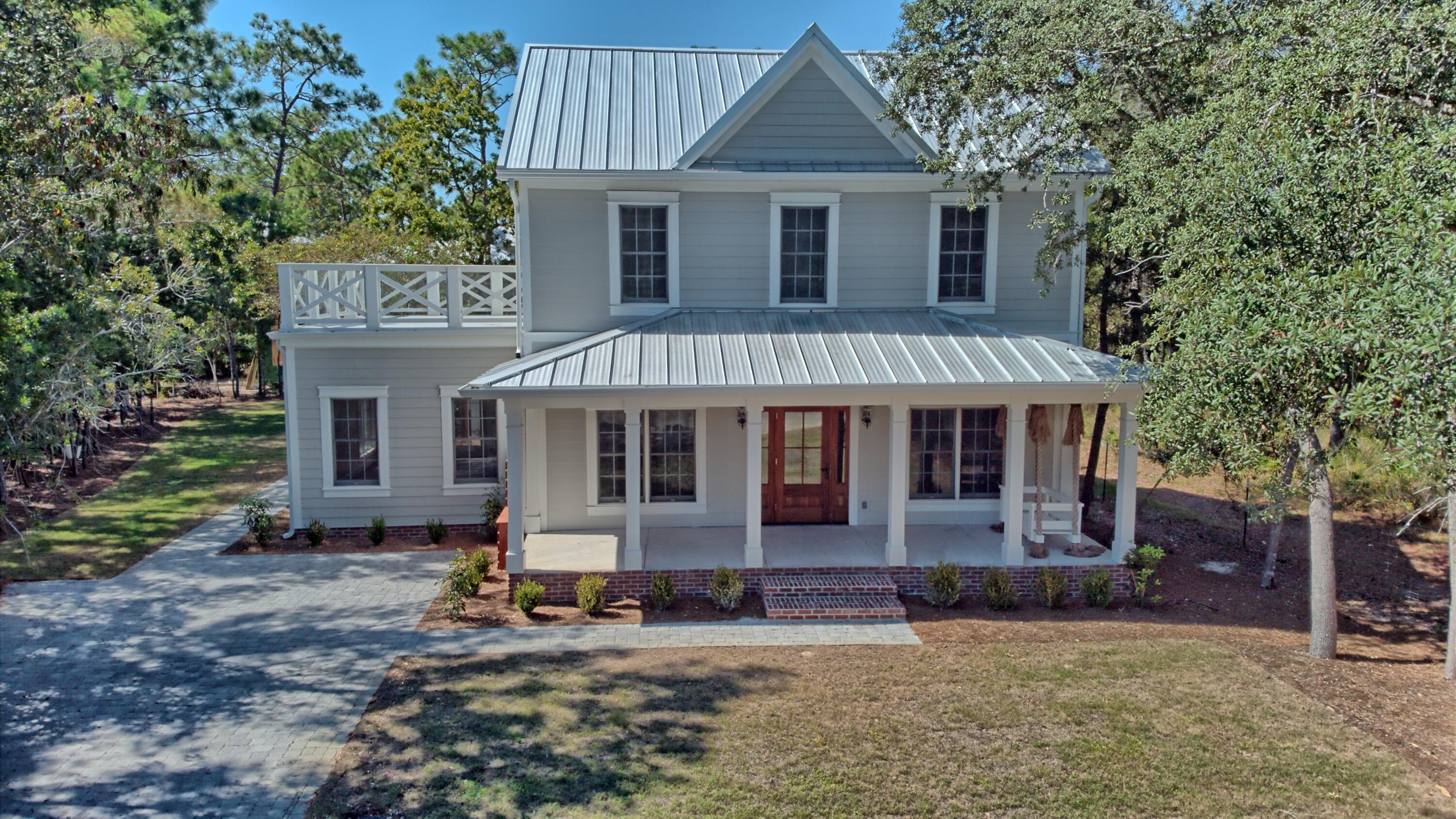 521 Clareon Drive Inlet Beach, FL 32461 - Photo 42 of 66 a front view of a house with a yard