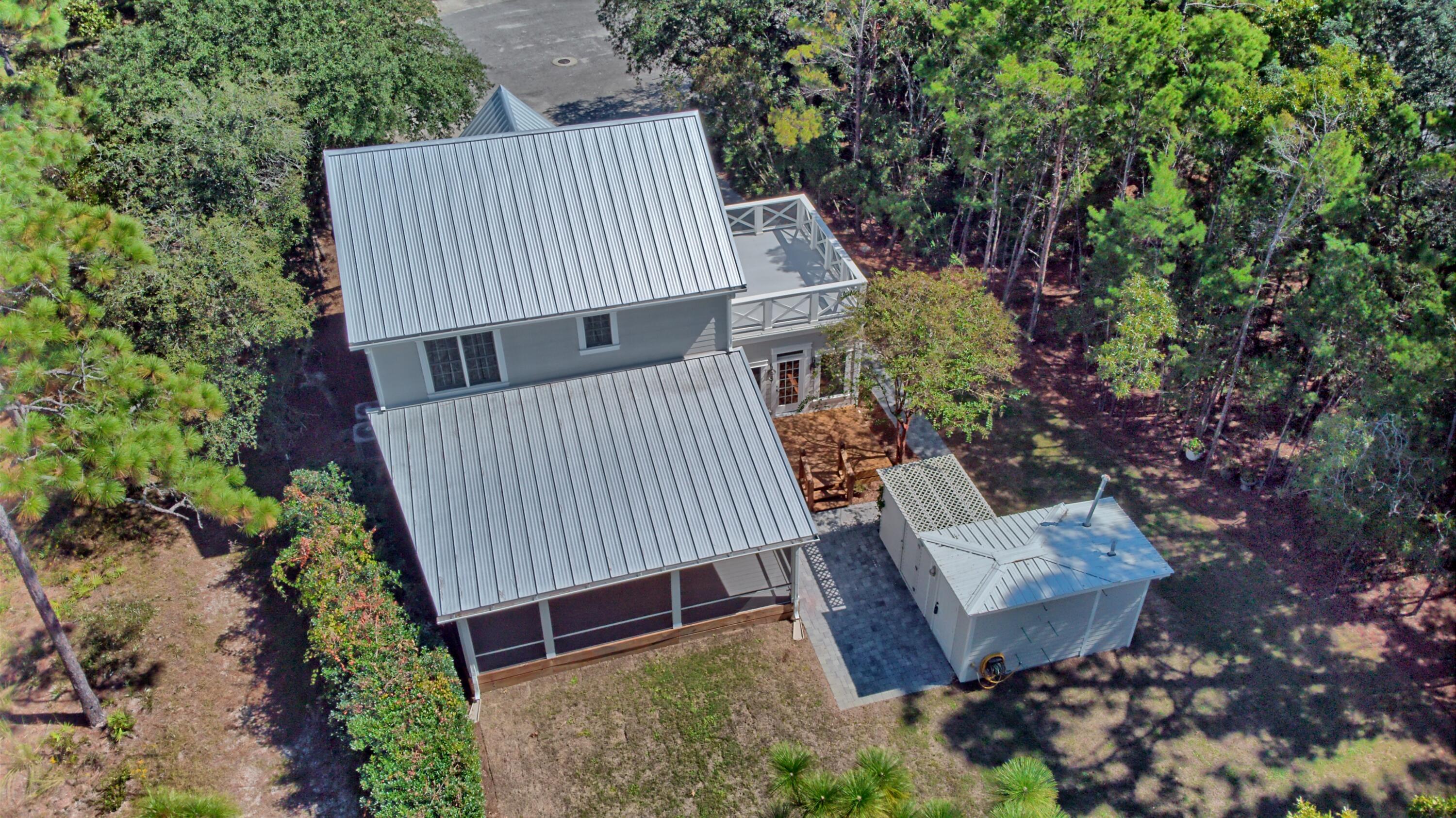521 Clareon Drive Inlet Beach, FL 32461 - Photo 44 of 66 an aerial view of a house having yard and balcony
