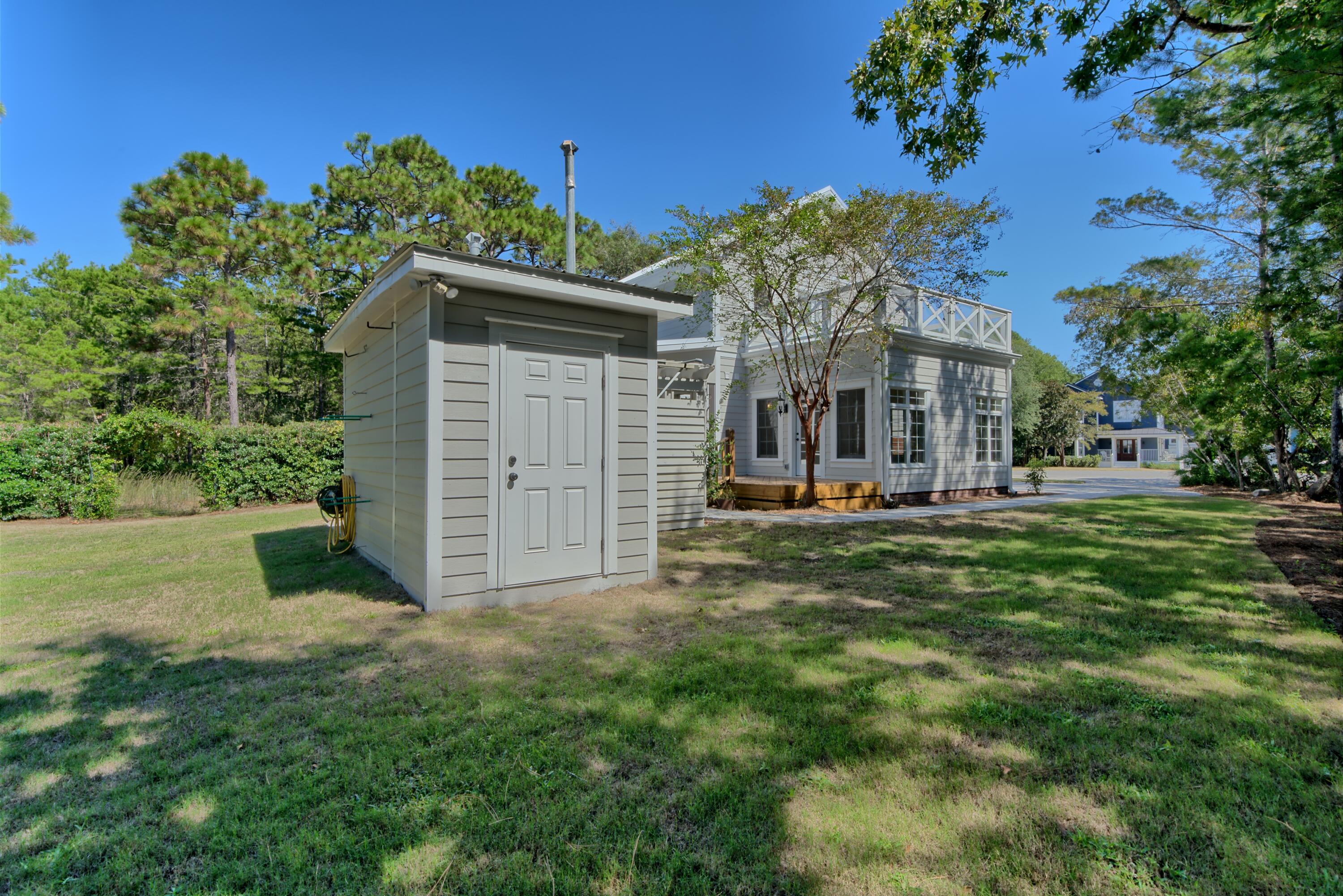 521 Clareon Drive Inlet Beach, FL 32461 - Photo 56 of 66 a view of a house with a yard