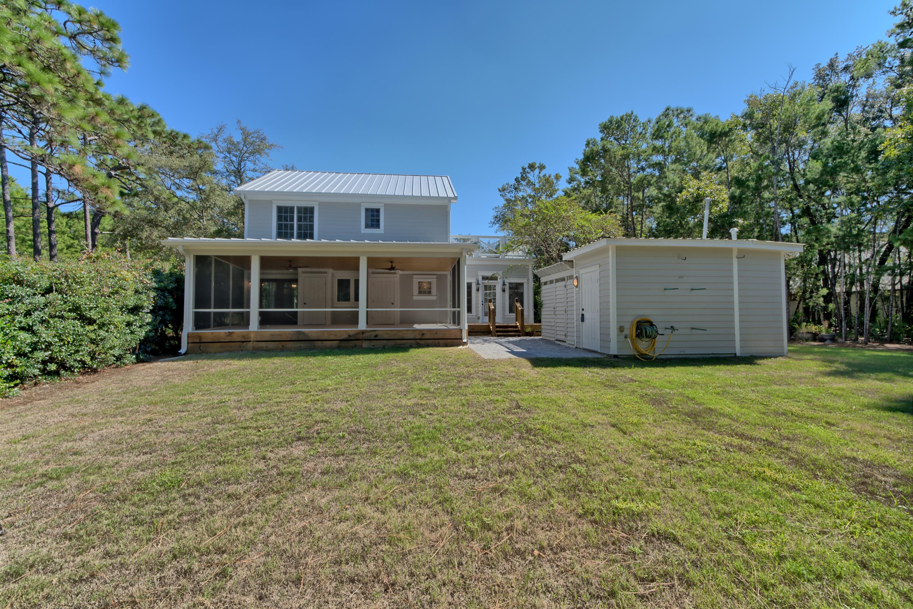 521 Clareon Drive Inlet Beach, FL 32461 - Photo 58 of 66 a house with trees in front of it