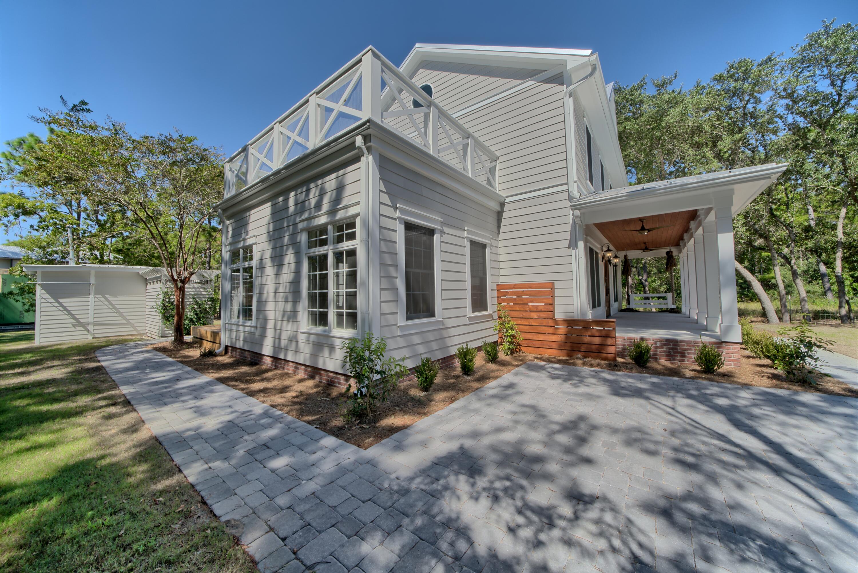 521 Clareon Drive Inlet Beach, FL 32461 - Photo 63 of 66 a front view of a house with a yard
