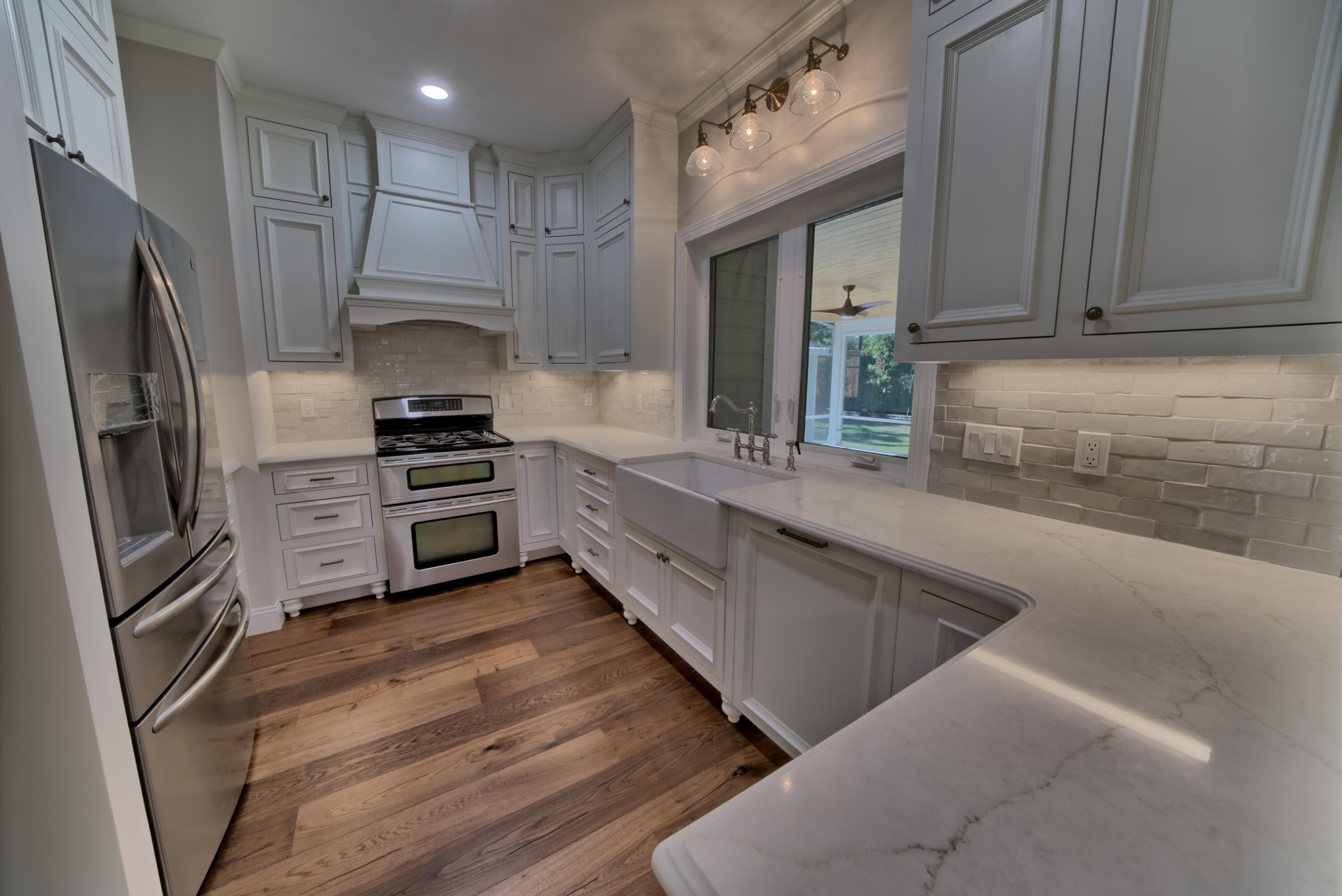 521 Clareon Drive Inlet Beach, FL 32461 - Photo 8 of 66 a kitchen with stainless steel appliances a sink stove and refrigerator