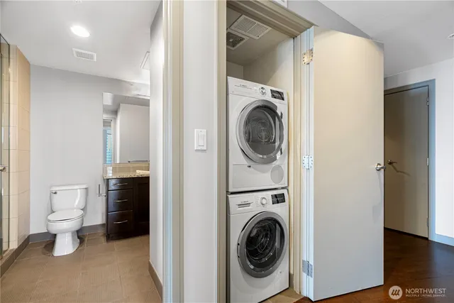 a view of a hallway with washer and dryer