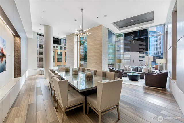 a view of a dining room with furniture window and wooden floor