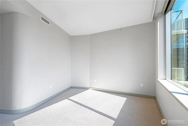 a view of an empty room and window