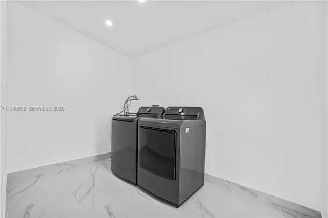a utility room with washer and dryer