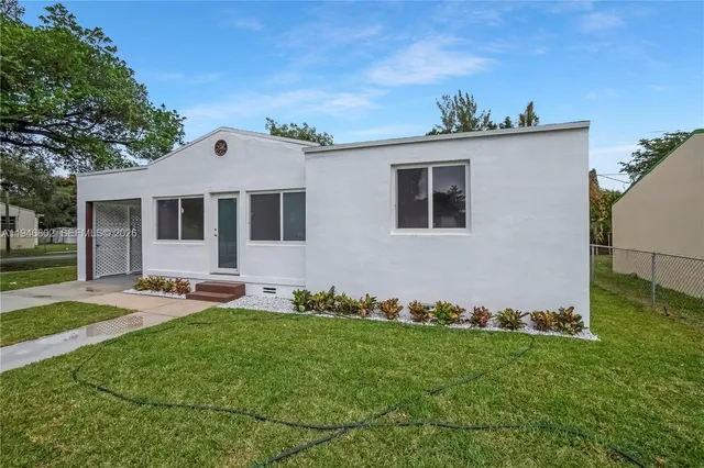 front view of a house with a yard