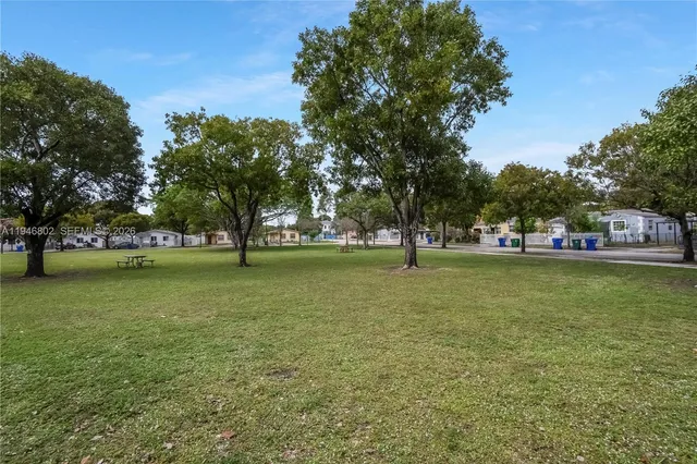 a view of outdoor space with garden and trees