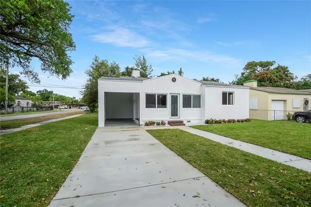 front view of a house with a yard