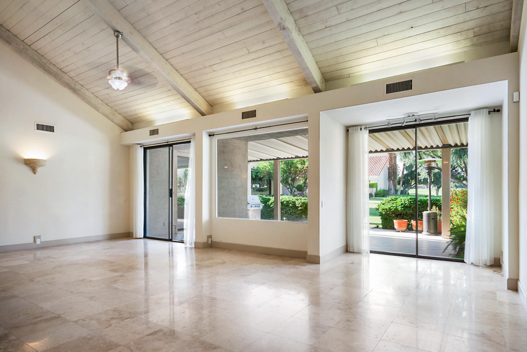 137 Desert W Drive Rancho Mirage, CA 92270 - Photo 12 of 56 a view of an entryway with wooden floor and garden