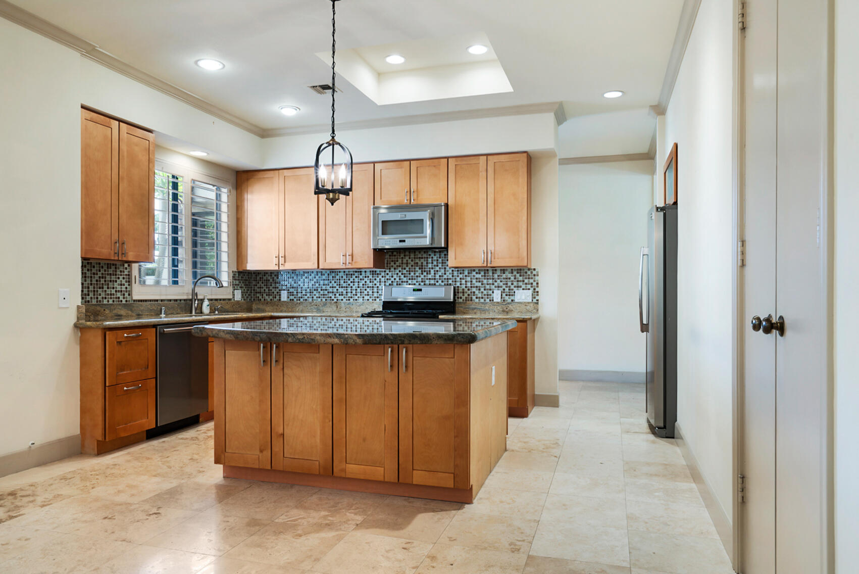 137 Desert W Drive Rancho Mirage, CA 92270 - Photo 15 of 56 a kitchen with stainless steel appliances granite countertop a refrigerator and a sink