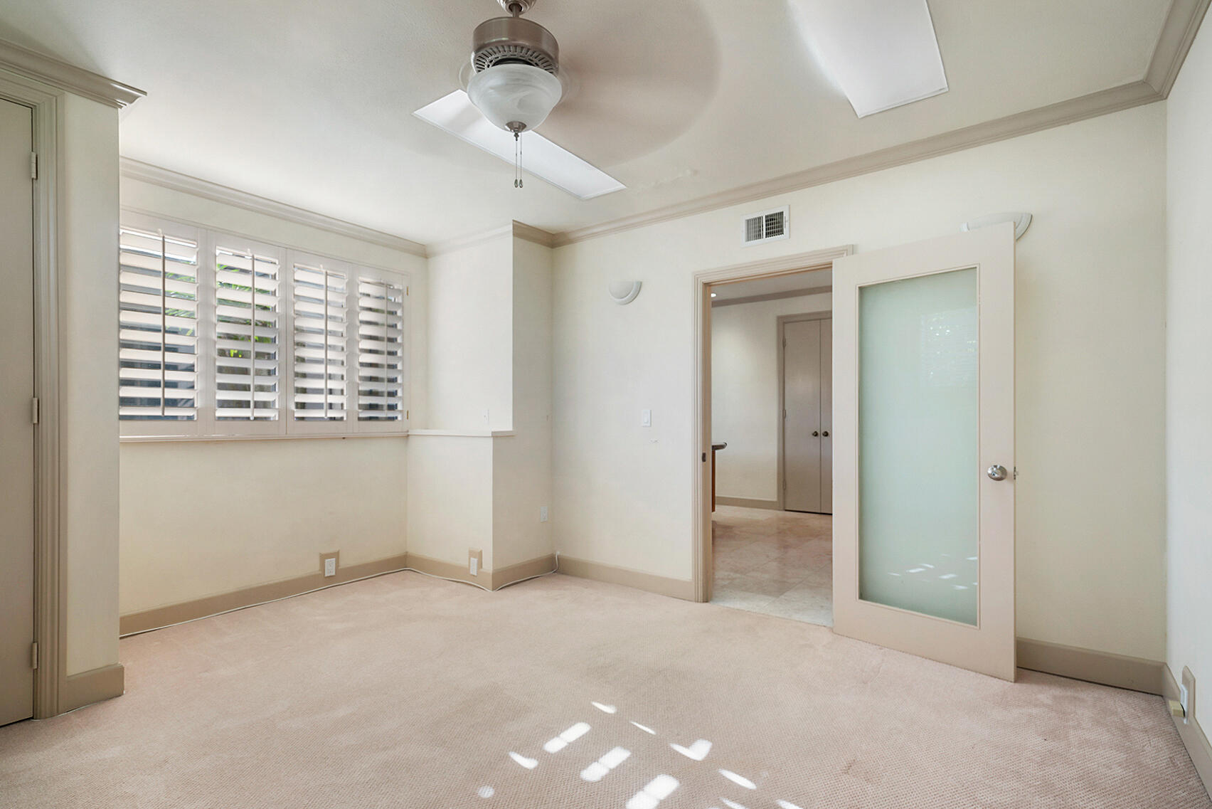 137 Desert W Drive Rancho Mirage, CA 92270 - Photo 23 of 56 a view of an empty room with a window