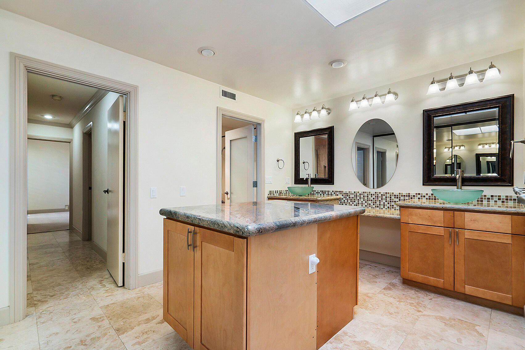 137 Desert W Drive Rancho Mirage, CA 92270 - Photo 31 of 56 a bathroom with a granite countertop sink and a mirror
