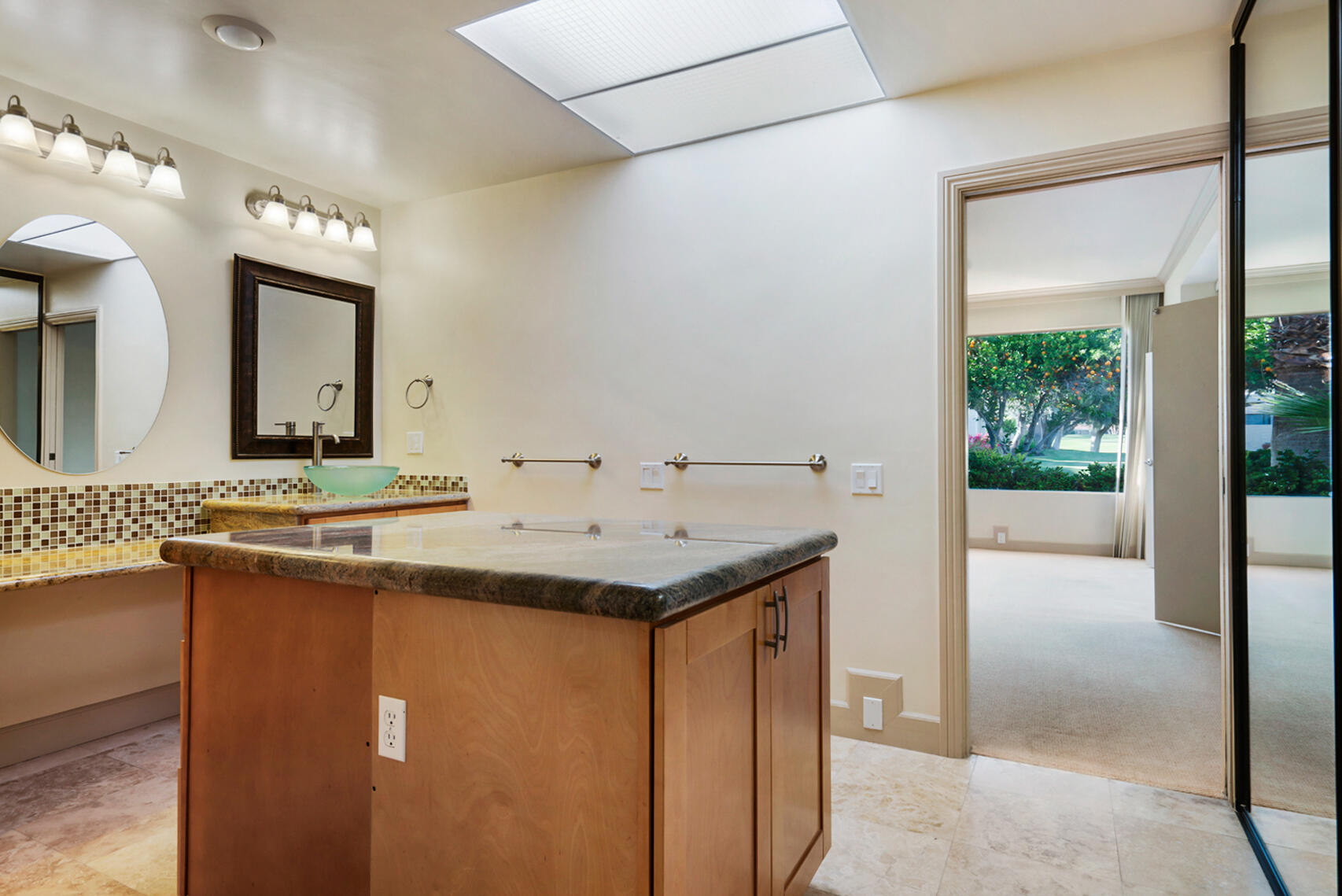 137 Desert W Drive Rancho Mirage, CA 92270 - Photo 33 of 56 a bathroom with a sink and a mirror