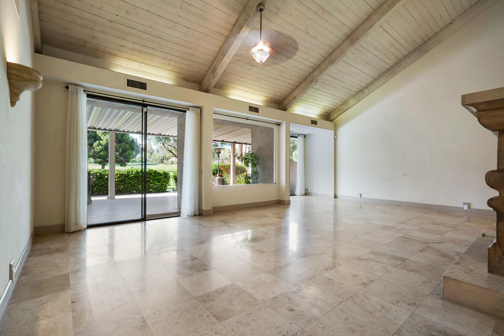 137 Desert W Drive Rancho Mirage, CA 92270 - Photo 4 of 56 a view of an empty room with a window