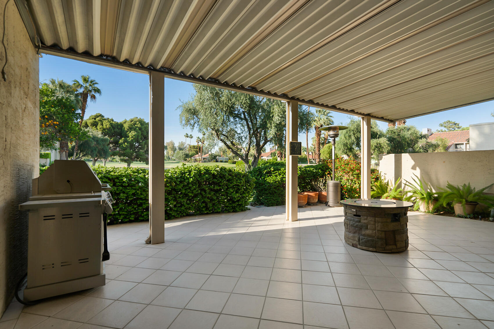 137 Desert W Drive Rancho Mirage, CA 92270 - Photo 44 of 56 a view of a chairs and table in the patio