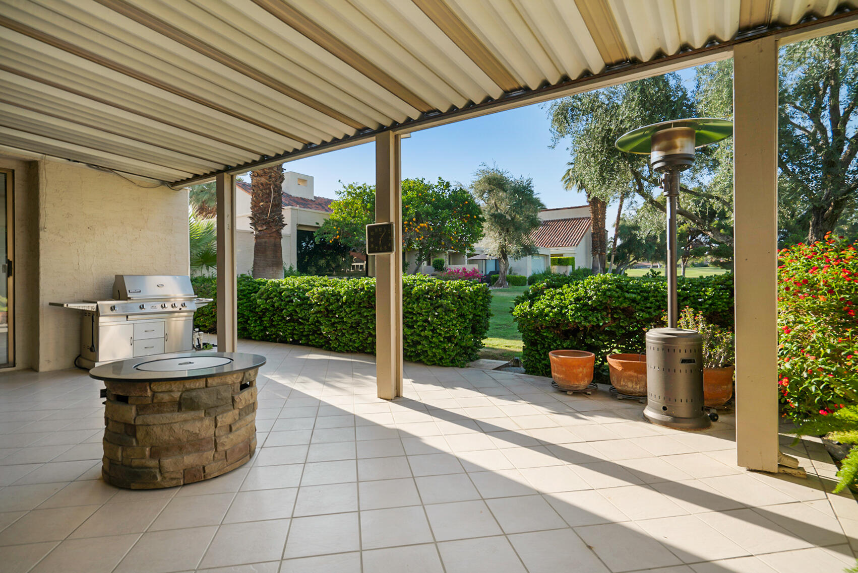 137 Desert W Drive Rancho Mirage, CA 92270 - Photo 46 of 56 a view of a porch with potted plants