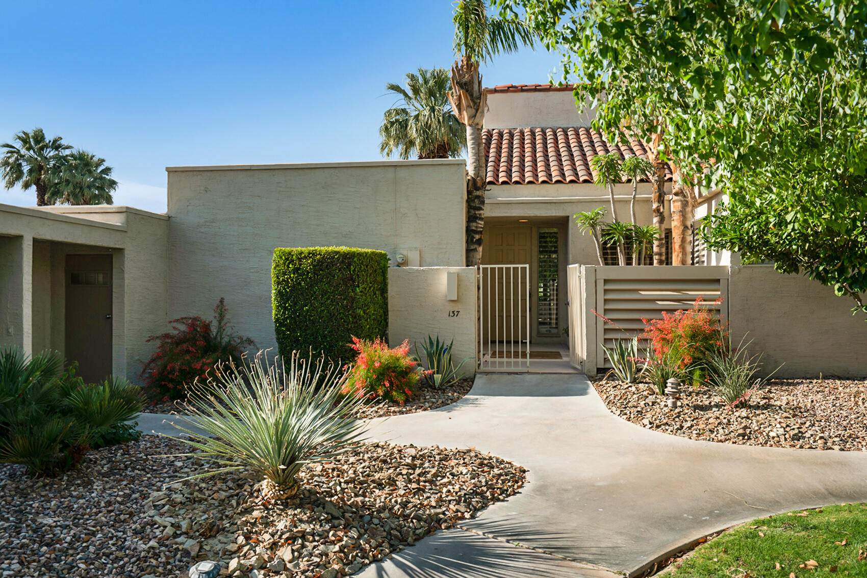 137 Desert W Drive Rancho Mirage, CA 92270 - Photo 48 of 56 a front view of a house