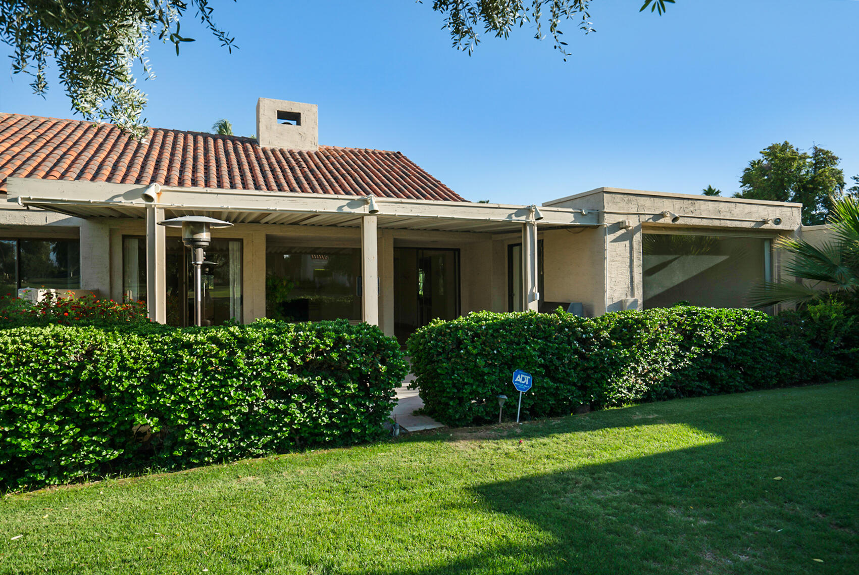 137 Desert W Drive Rancho Mirage, CA 92270 - Photo 51 of 56 a front view of a house with a garden