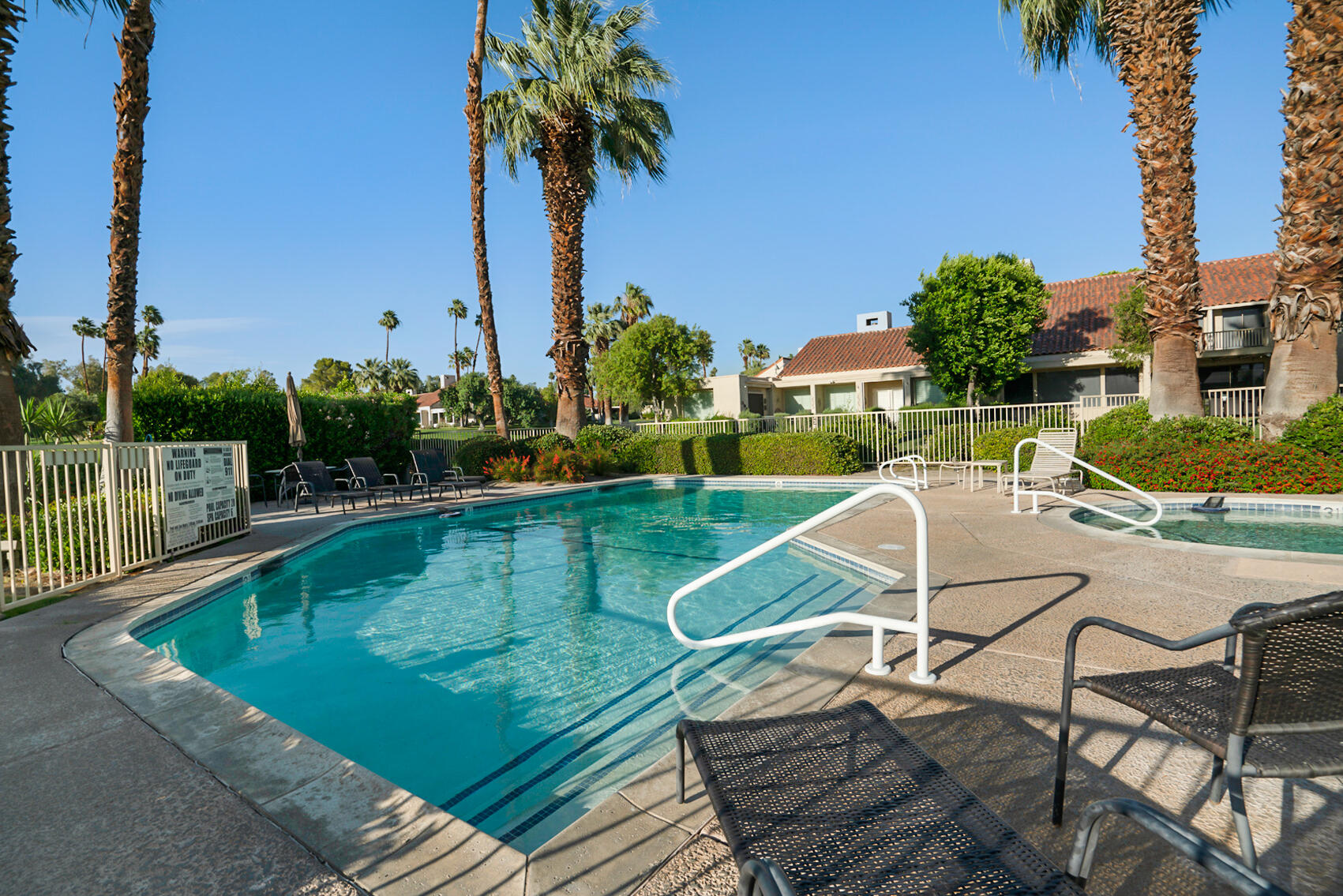 137 Desert W Drive Rancho Mirage, CA 92270 - Photo 55 of 56 a view of a swimming pool with a patio