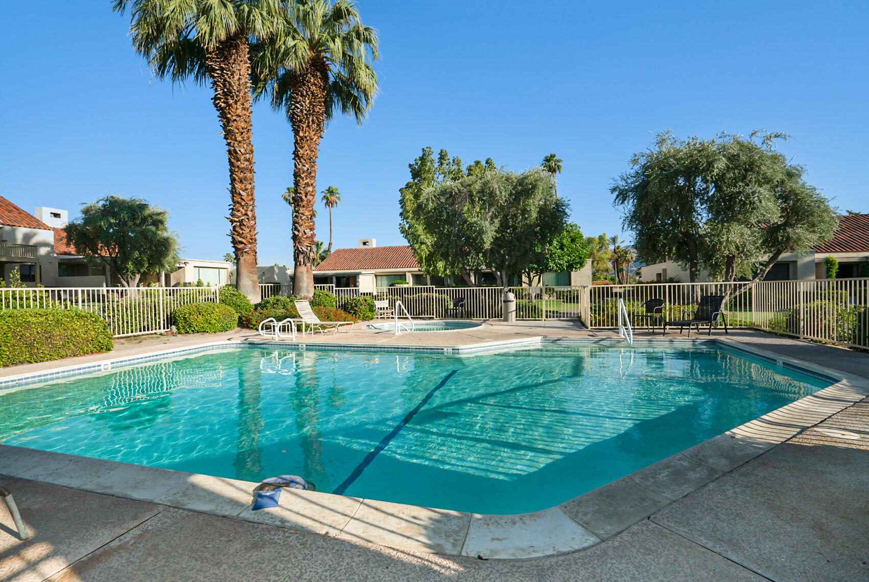 137 Desert W Drive Rancho Mirage, CA 92270 - Photo 56 of 56 a view of a swimming pool with a garden